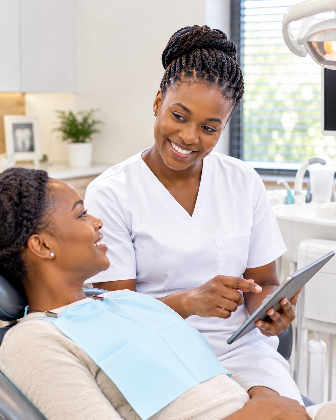 A dentist and patient talking through a treatment plan